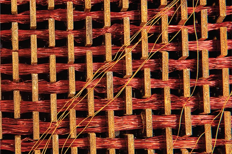 Macro photo of Apollo core-rope memory: copper wires woven through magnetic cores